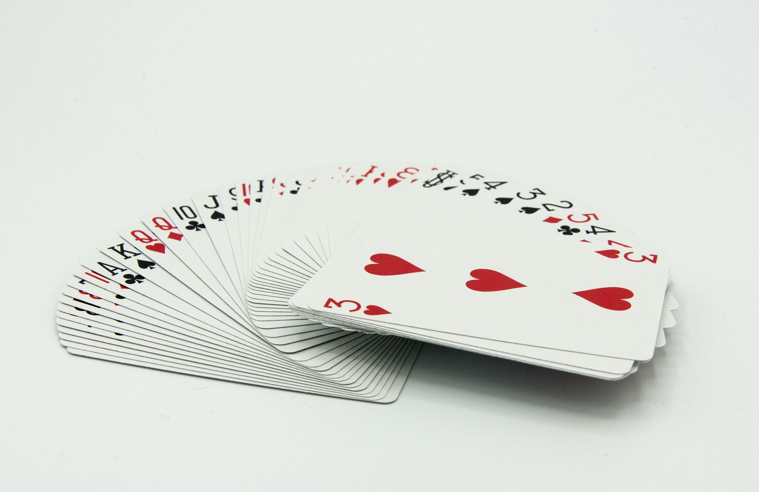 Full deck of cards on white background
